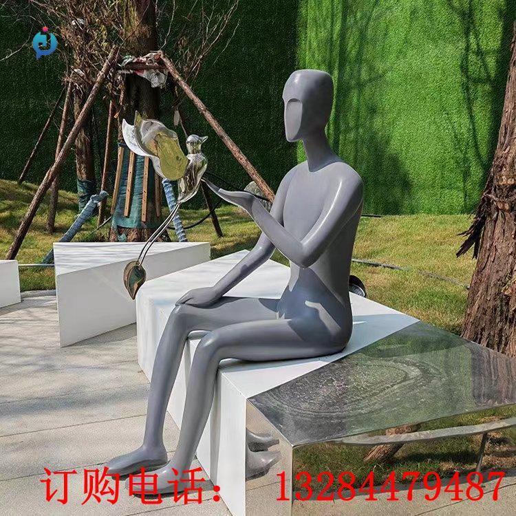 不銹鋼人物逗鳥雕塑